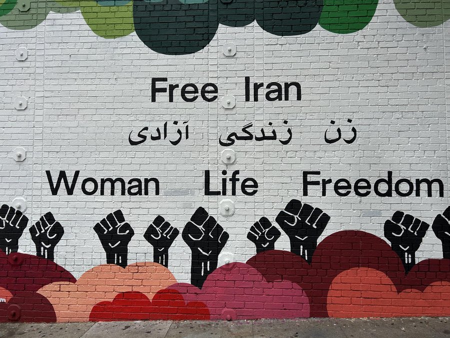 Mural reading Free Iran, Woman Life Freedom